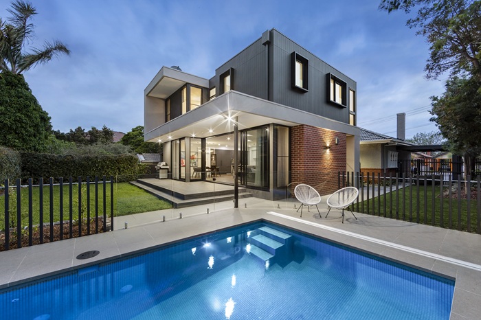 Modern home beside a swimming pool